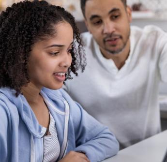 Student and parent on laptop