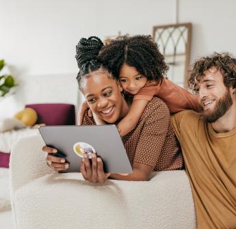 family using laptop together