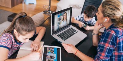 Parent and child working and learning virtually