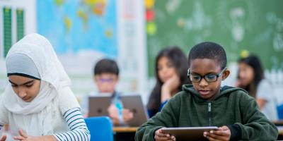 Students working on technology in classroom