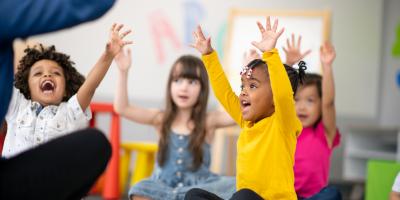 Students with hands up