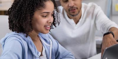 Student and parent on laptop