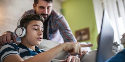 Student and parent on laptop