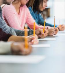 Students writing on paper